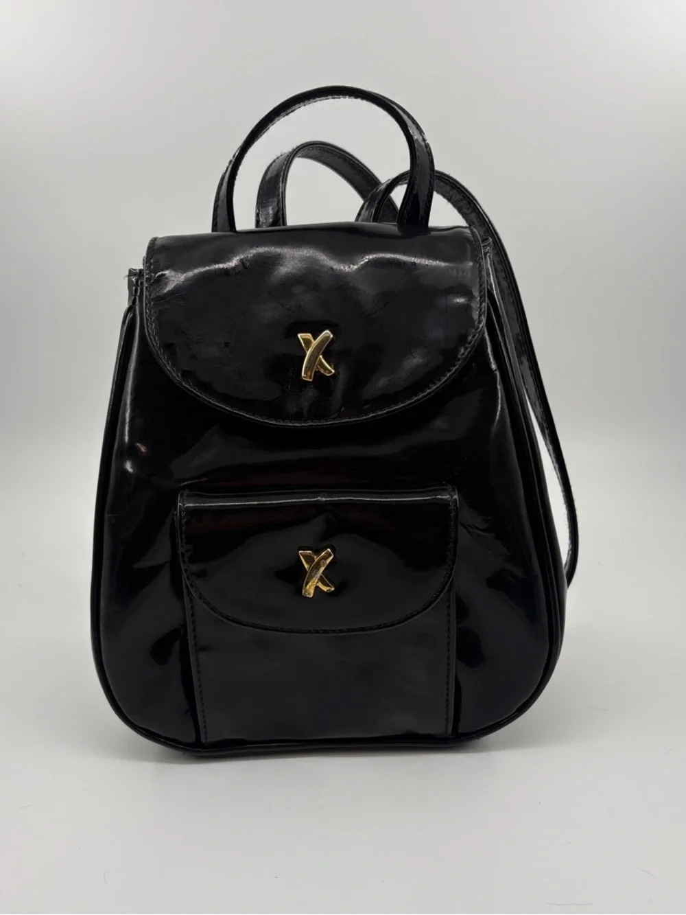 Paloma Picasso Black Patent Mini Backpack with Gold X Hardware